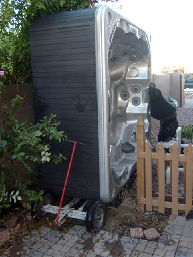 Az Spa and Hot Tub Movers removing a spa through a narrow gate way Az Spa and Hot Tub Movers removing a spa through a narrow gate way